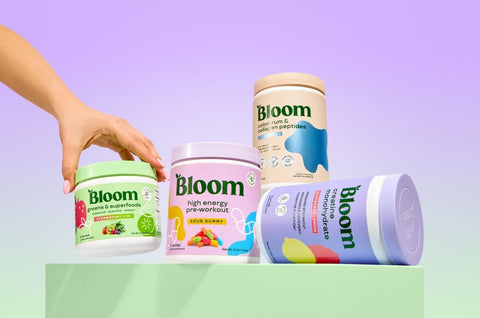 Four containers of Bloom products on a gradient background